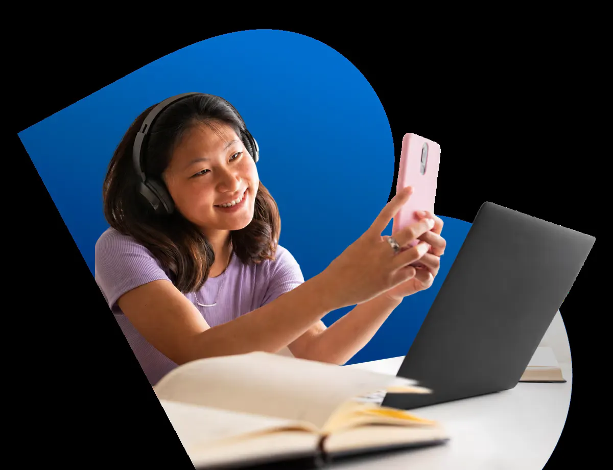 Student watching IPTV on a phone and laptop in Canada