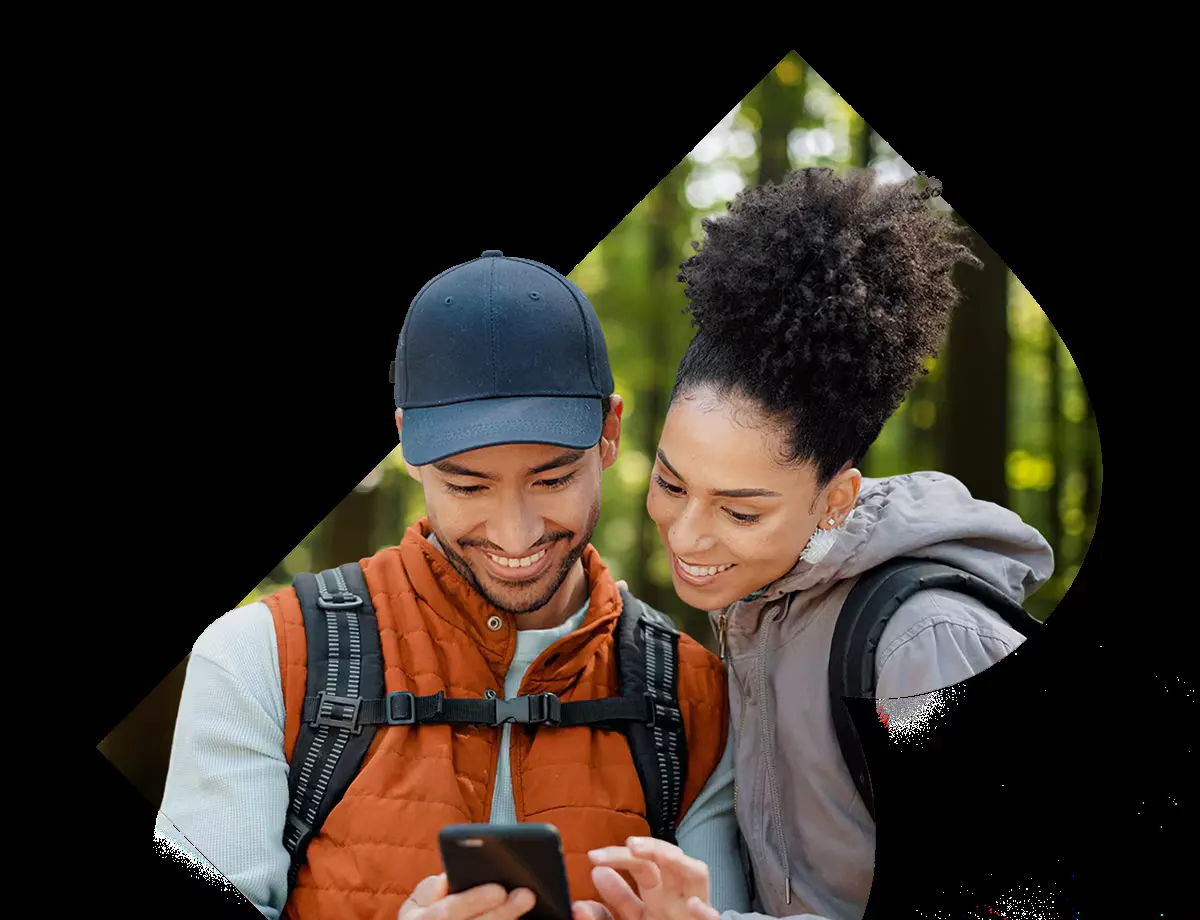Couple streaming IPTV on a phone outdoors in Canada